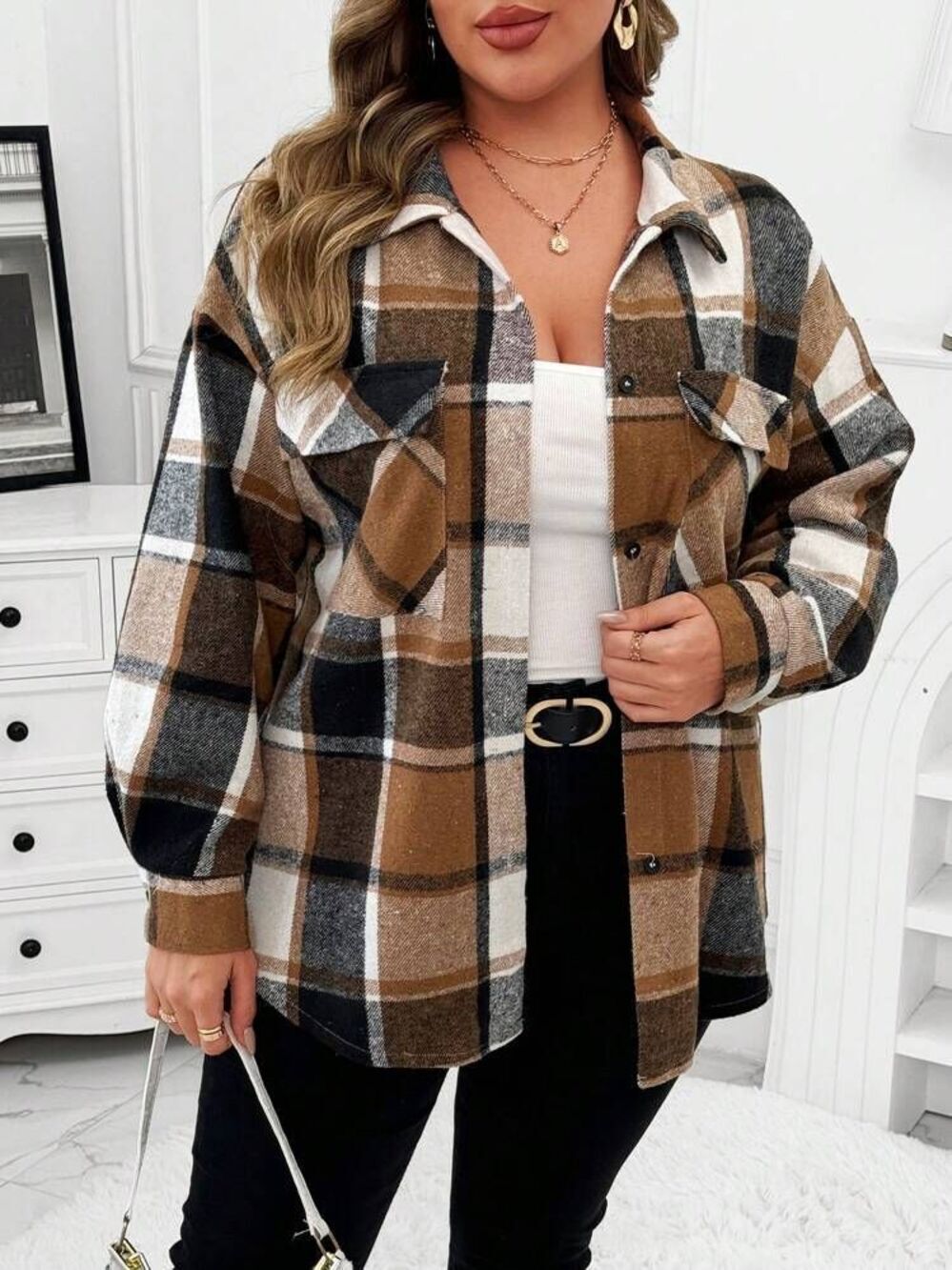 Women's brown and black plaid flannel shacket featuring dual chest flap pockets